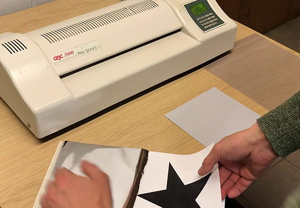 A picture of a Omnicrom machine. A process for allying block of flat colour, in particular foils, to photocopies for mock-ups.